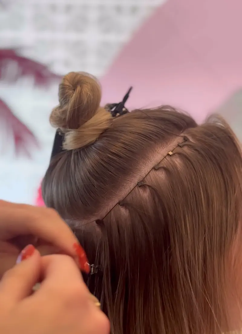 Extensions being placed at Salon D'Mar